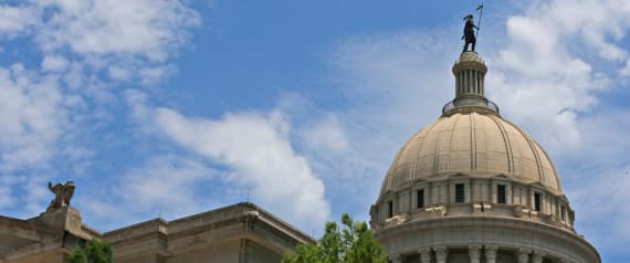 Workers build scaffolding at the state Capitol in Oklahoma City, Thursday, June 11, 2015. Assessments and test phases of exterior repair are beginning on the nearly 100-year-old building. The Oklahoma Legislature approved a $120 million bond issue last year to pay for renovations to the building. (AP Photo/Sue Ogrocki)